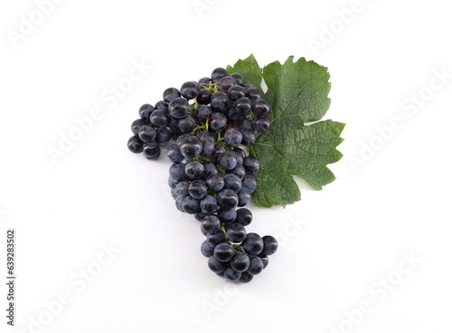 Cabernet franc grape with leaf on white background.	 photo