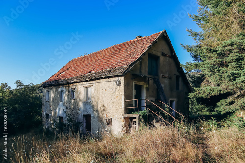 Old abandoned house of the 19th century in the village of Acquabianca, Italy photo