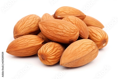 Heap of organic almond for healthy snack. Nature bounty. Close up of Fresh almonds on white background isolated. Wholesome delight. Pile of nutritious