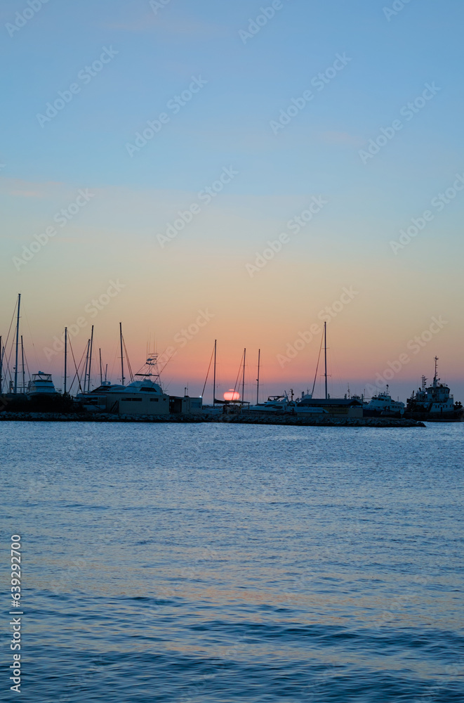 Santa Marta, Colombia - December 30 2022: Scenic view of a port in Santa Marta, Colombia during the sunset