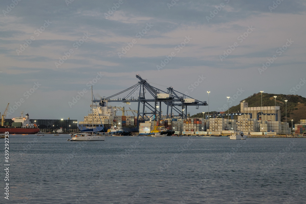 Santa Marta, Colombia - December 30 2022: Beautiful Harbor view with container ships in port of Santa Marta in Colombia