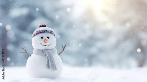 Happy snowman in winter scenery with copy space, blurred bokeh snow magical white landscape background photo
