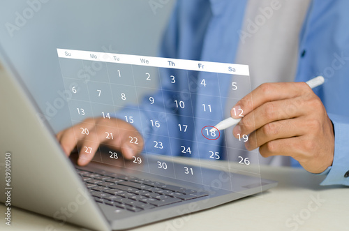Businessperson or secretary manages time for effective work. Calendar on the virtual screen interface. Highlight appointment reminders and meeting agenda on the calendar. Time management concept..