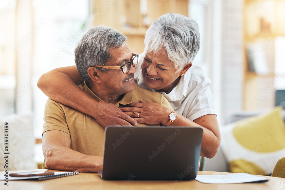 Laptop, senior couple and hug at table in home, bonding and care together on social media. Computer, embrace and elderly man and woman happy, smile and connection to support, love and typing email Laptop, senior couple and hug at table in home, bonding and care together on social media. Computer, embrace and elderly man and woman happy, smile and connection to support, love and typing email