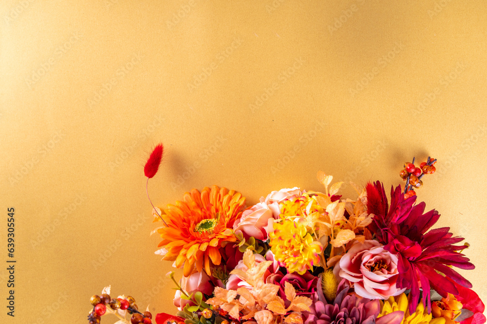Fototapeta premium Autumn holidays greeting card background. Autumn red, orange, bright flowers and leaves a big bouquet on white gold background. Teacher's Day, Thanksgiving Day, Halloween background