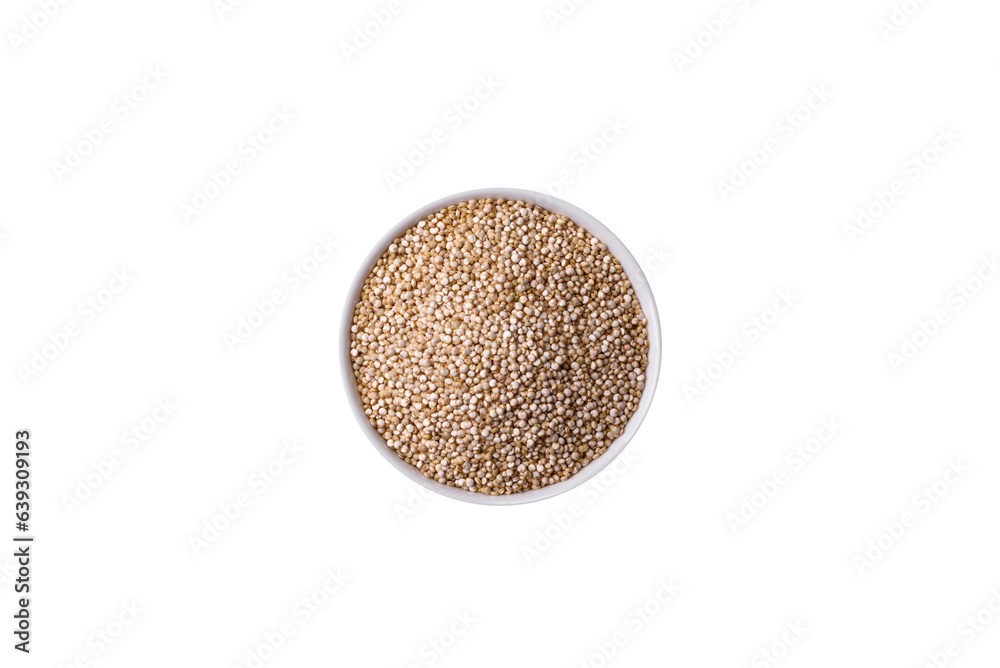 Wholesome raw quinoa in a bowl on a dark concrete background Wholesome raw quinoa in a bowl on a dark concrete background