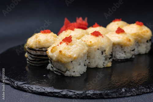 Delicious rolls on a dark background. Japanese cuisine. Close up 