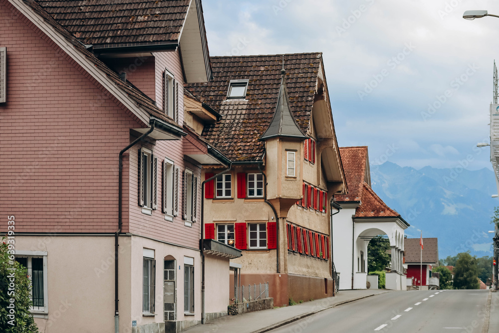 Alpnachstad, Switzerland - August 9, 2023: Beautiful facades of the Swiss Alpnachstad