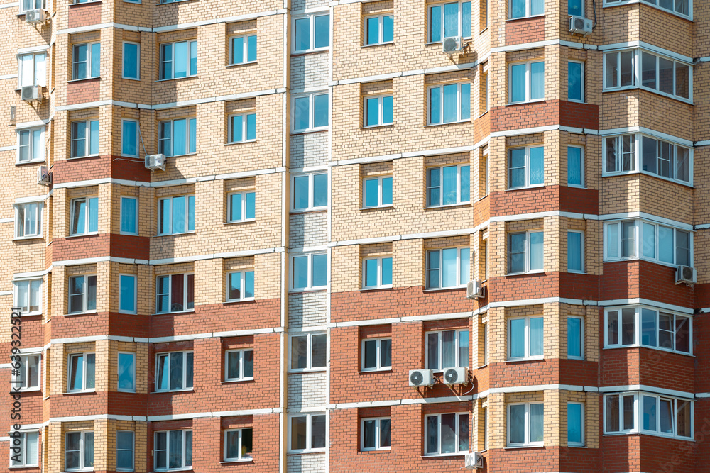 Windows and walls in a multi-storey building. Background