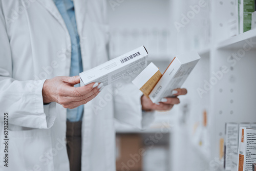 Person, pharmacist and hands with boxes of medication, pharmaceutical or pills on shelf at drugstore. Closeup of medical or healthcare employee with drugs, prescription meds or inspection at pharmacy