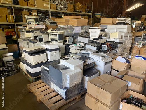 Sorting electronic waste for recycling. Cell phone photo of a warehouse. photo