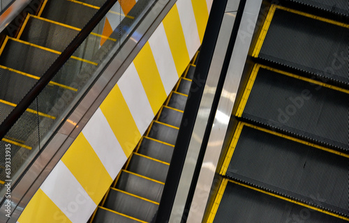 escalator in a shopping center top view in public space,3 floors escalator.
