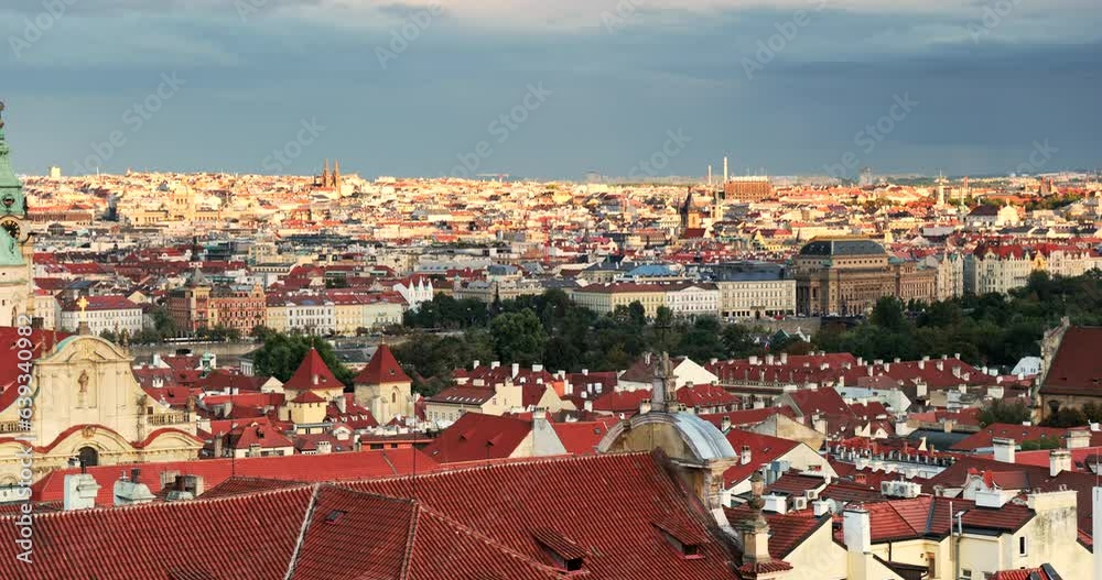 Prague city skyline view from the Prague Castle of the residential houses in the Mala Strana with the Towers of the Church of Saint Nicholas, Czech republic