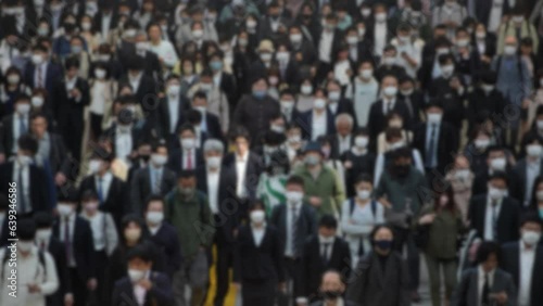 Wallpaper Mural Blurred defocused view of from above, a sea of people moving in unison, with hardly any space between them. This is the daily scene in Tokyo, where the city's density is on full display Torontodigital.ca