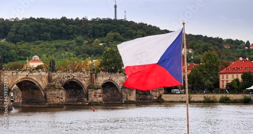 Czech national flag flies over the Vltava River in Prague Czech Republic Czechia