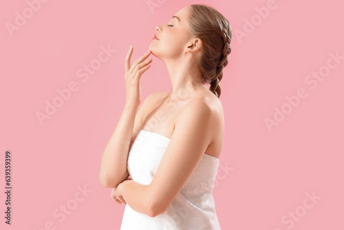 Wallpaper Mural Pretty young woman wrapped in towel on pink background Torontodigital.ca