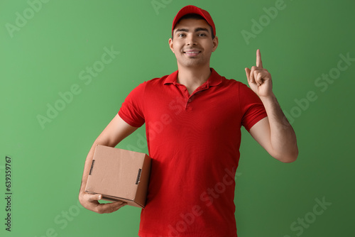 Male courier with parcel po...