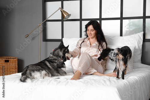 Young woman in pajamas rela...