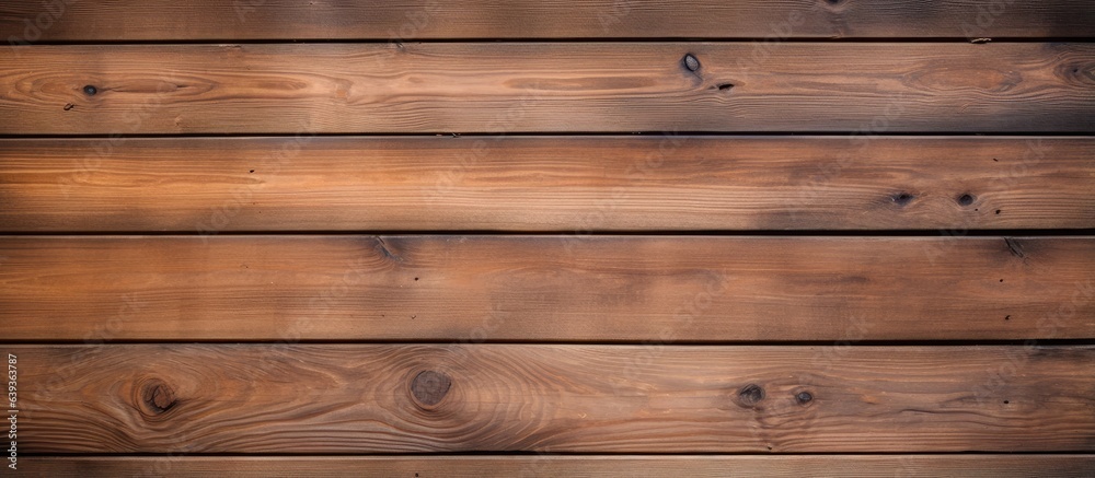 Fototapeta premium Wooden boards used for decking and paneled walls showcasing the textures and patterns of natural wood Ideal for interior backgrounds and modern design concepts