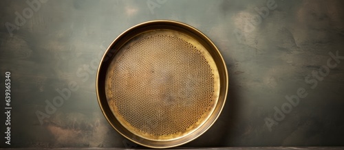 Brass sieve antique style on concrete Space for text