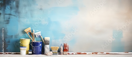 Indoor wall with tools and paints for decorators Text space