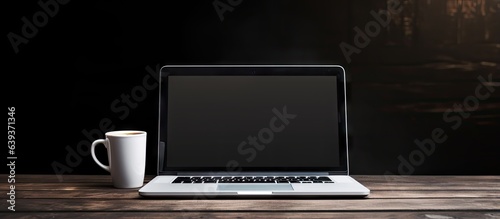 Laptop notebook and coffee cup on white table Free area