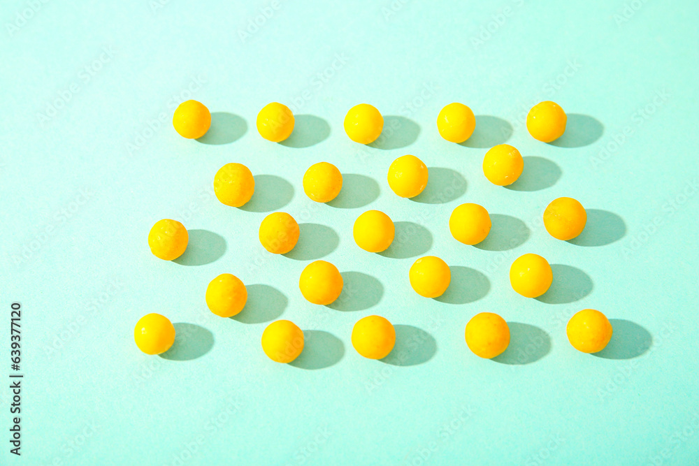 Yellow pills on blue background