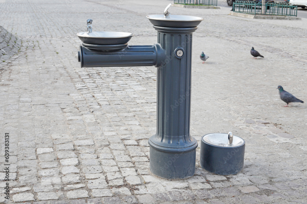 Street tap with drinking water for people and animals. Street tap with drinking water for people and animals.