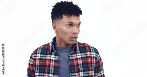 Nervous, scared and man with anxiety, afraid or confused guy isolated on a white studio background. Person, suspicious or model looking around, under pressure or stress with fear, emotion or suspense photo