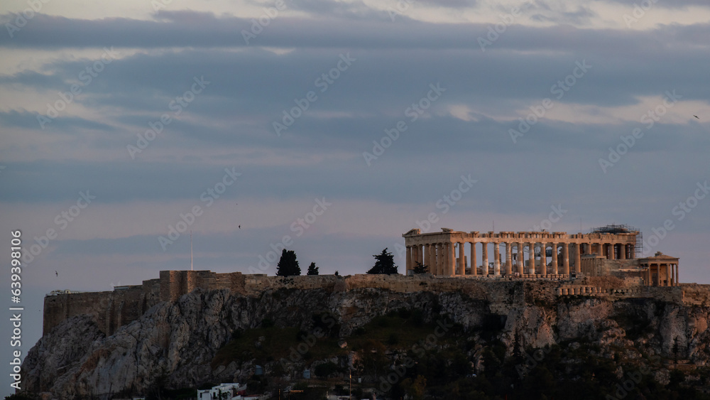 The Acropolis view with the Parthenon in Athens Greece in the evening. 
