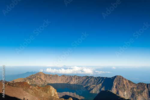 Mount Rinjani crater and lake view from summit at sunrise, Lombok, Indonesia. Rinjani is the second highest active volcano in Indonesia