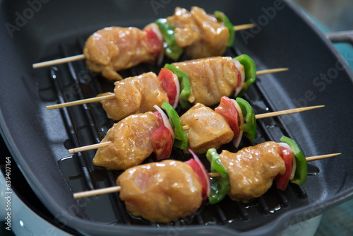 Shish Tawook or Grilled chicken with tomato pieces, green pepper and onion pieces, ready for grilling