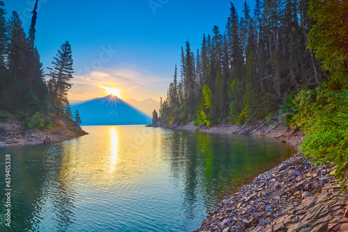 Sunrise peaking over Mount Murry on Hungry Horse Reservoir in the Flathead National Forest, MT. photo