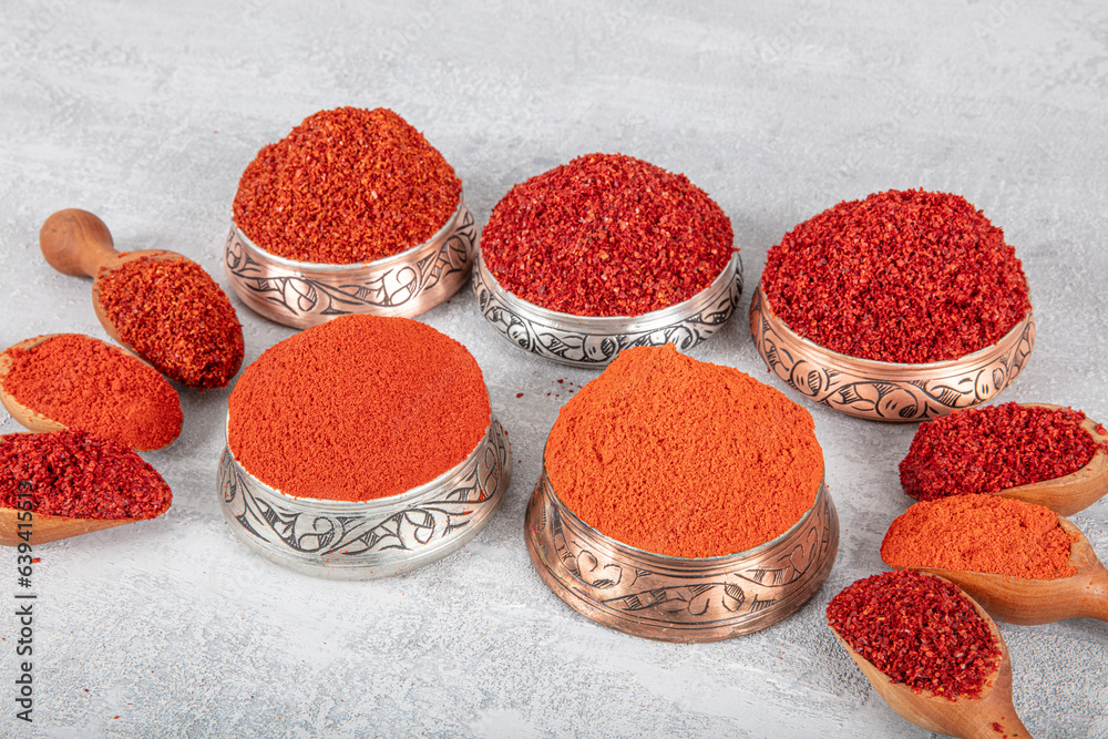 Hot chili pepper, sweet chili flakes and chili powder spice concept