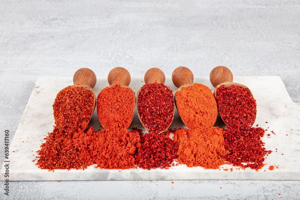 Hot chili pepper, sweet chili flakes and chili powder spice concept