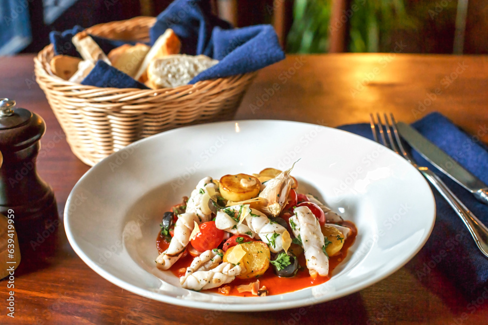 Squid stew with baby potato and baby tomatoes Squid stew with baby potato and baby tomatoes