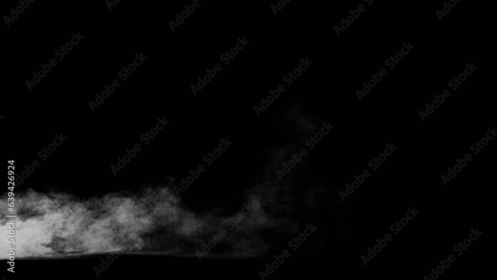Video of low mist, steam, fog blowing into and through the frame, 4k 24p with alpha channel for transparent background. The mist glides across the ground plane Video of low mist, steam, fog blowing into and through the frame, 4k 24p with alpha channel for transparent background. The mist glides across the ground plane