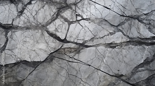 Photo of a detailed close-up of a weathered rock with prominent cracks and textures