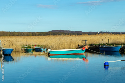 harbor at Achterwasser in Zempin at the baltic sea in Usedom with wooden fisher boats