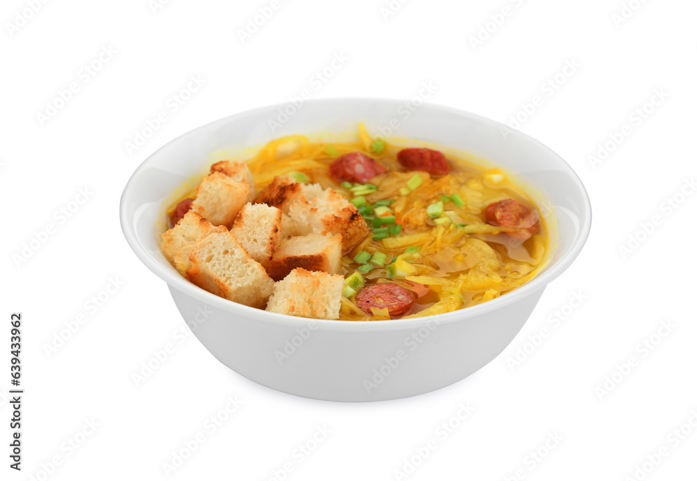 Bowl of delicious sauerkraut soup with smoked sausages, green onion and croutons isolated on white Bowl of delicious sauerkraut soup with smoked sausages, green onion and croutons isolated on white