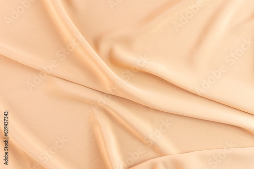 Abstract silk background peach fabric fancy liquid waves 