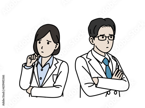 考え込む白衣を着た男女の医師