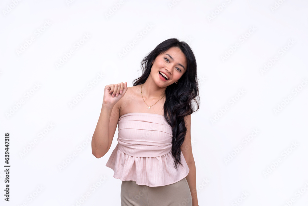 A vivacious and animated young lady pretends to knock on a door. Gesturing with her knuckle. Isolated on a white backdrop A vivacious and animated young lady pretends to knock on a door. Gesturing with her knuckle. Isolated on a white backdrop