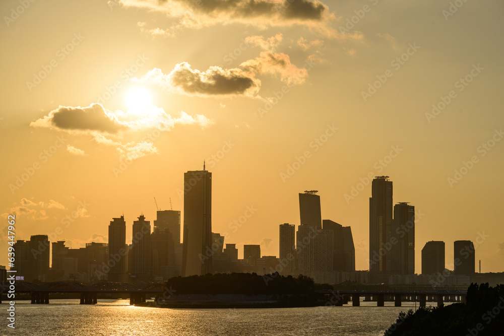 The night view of the city of Yeouido, a high-rise building, shot at Dongjak Bridge in Seoul at sunset