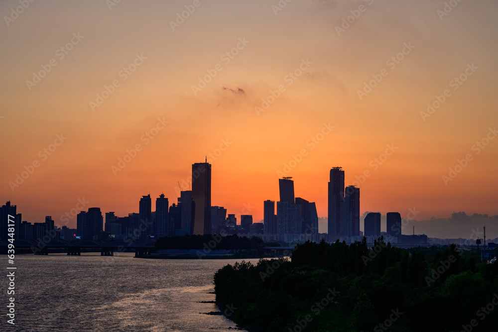 The night view of the city of Yeouido, a high-rise building, shot at Dongjak Bridge in Seoul at sunset