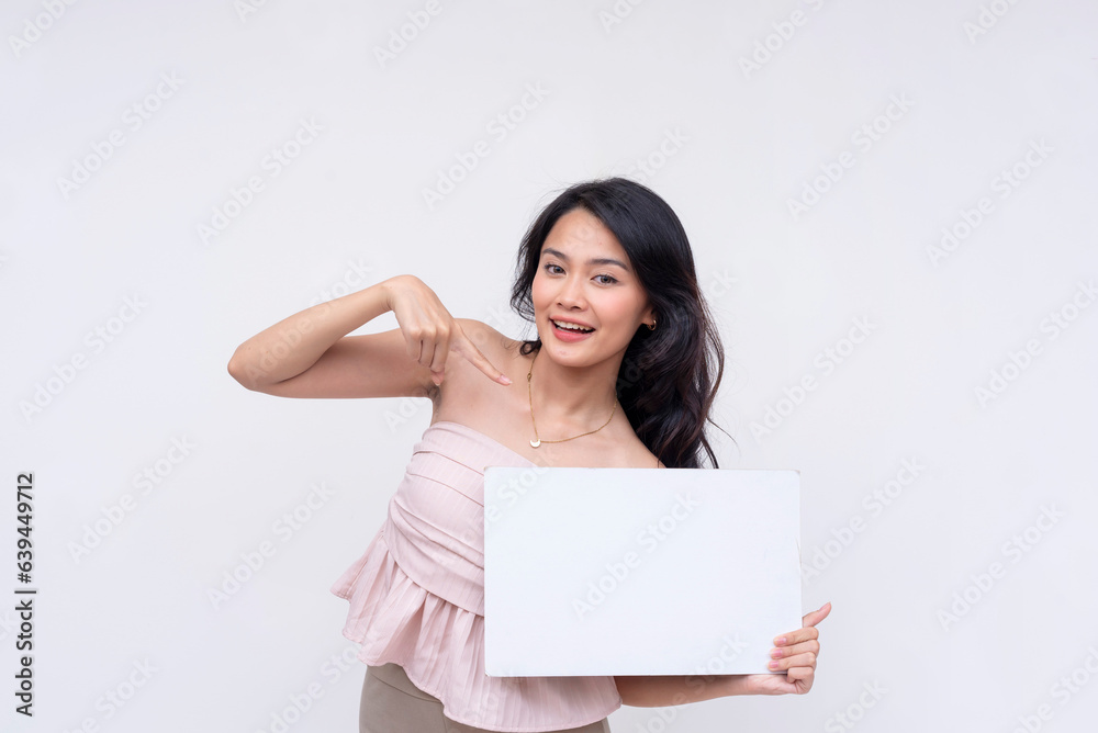 A pretty young Asian woman actively endorses a white blank signage she is holding. Isolated on a white background. A pretty young Asian woman actively endorses a white blank signage she is holding. Isolated on a white background.