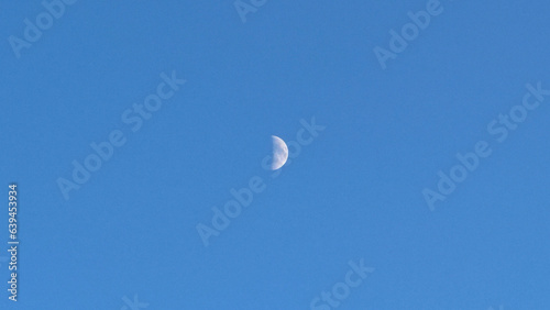 half moon in the sky daytime blue sky lunar emotional sentimental clear sky background wallpaper minimalist