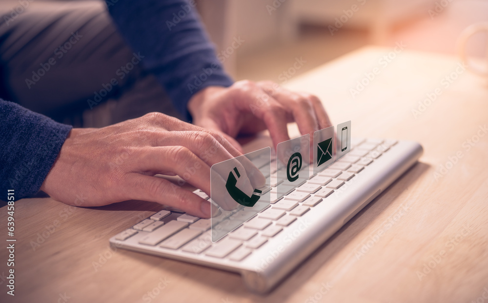 Businessman using wireless computer keyboard searching web, browsing information, contact, having workplace at home. concept Contact us or Customer support hotline people connect, customer services Businessman using wireless computer keyboard searching web, browsing information, contact, having workplace at home. concept Contact us or Customer support hotline people connect, customer services