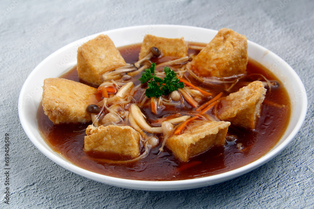 Freshly cooked Chinese food Tofu with mushroom in oyster sauce Freshly cooked Chinese food Tofu with mushroom in oyster sauce