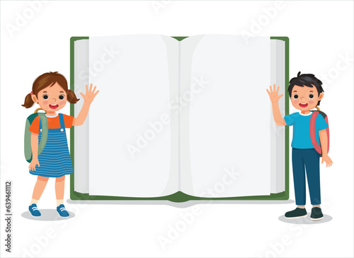 Little kids students with backpack standing in front of opened blank big book waving hand